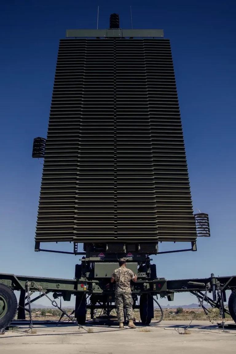 Long-range military radar antenna at dusk — an RF system Ampwave Defense power tubes keep in service for decades.