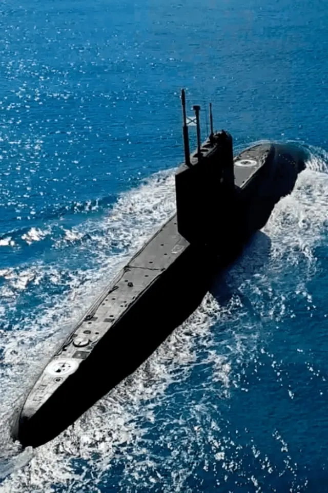 Naval submarine underway at sea — an electronic-warfare platform supported by Ampwave Defense RF power technology.